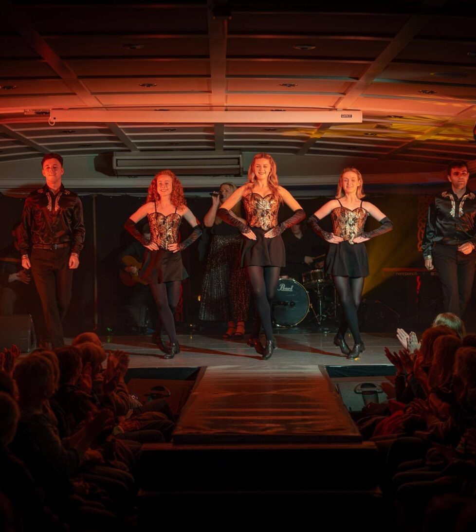 Guests enjoy vibrant live entertainment with talented dancers in elegant costumes at the hotel's stylish performance venue.